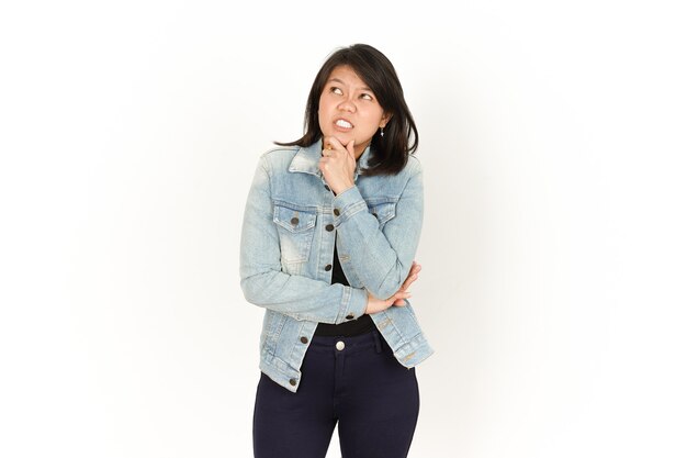 Thinking of Beautiful Asian Woman Wearing Jeans Jacket and black shirt Isolated On White Background