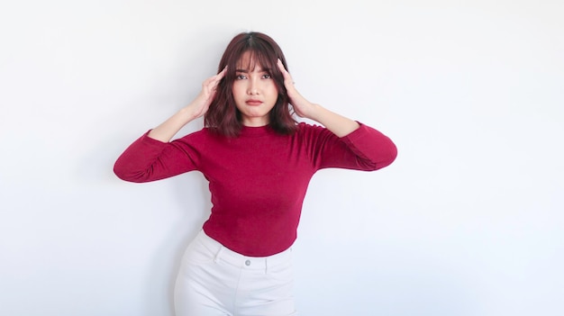 Thinking gesture of Asian beautiful girl with red shirt in white background