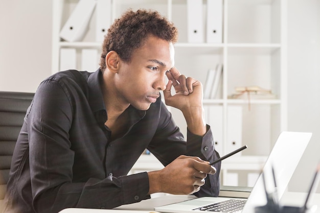 Thinking man working on project