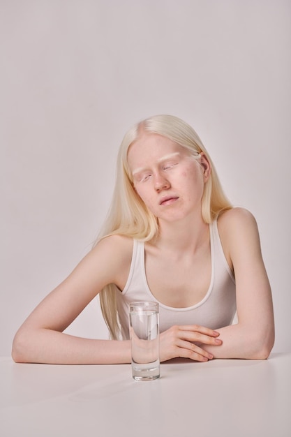 Thirsty woman with unusual appearance