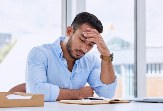 This day needs to end Shot of a young businessman in his office