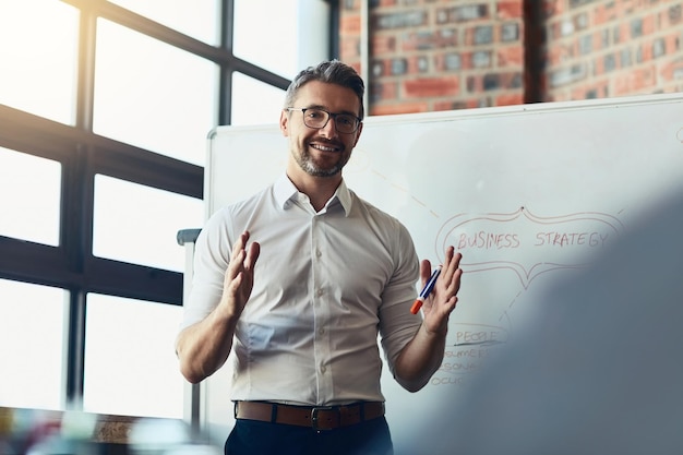 This is exactly where we want to be. Cropped shot of a mature businessman giving a presentation in the boardroom.