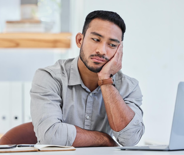 This is has been the most uneventful day Shot of a young businessman being bored at work