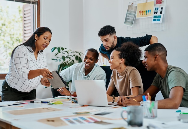 This is what the competition is looking like Shot of a group of young businesspeople using a digital tablet during a meeting in a modern office