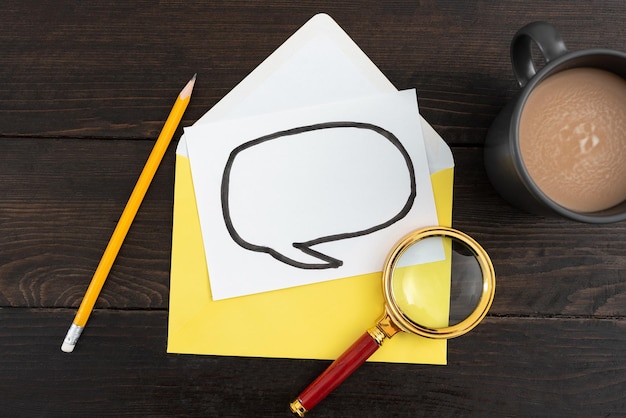 Thought Bubble Drawing On Paper With Envelope Coffee Cup And Stationery On Wooden Background Business Plans With Drink On Table It Is Showing Crucial And Important News