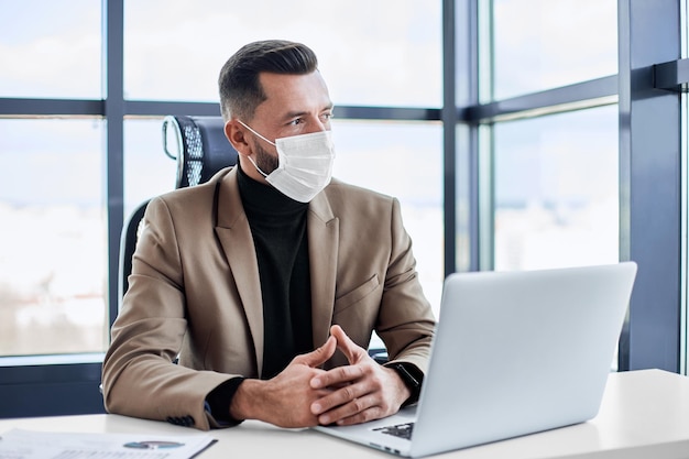 Thoughtful business man sitting at his desk