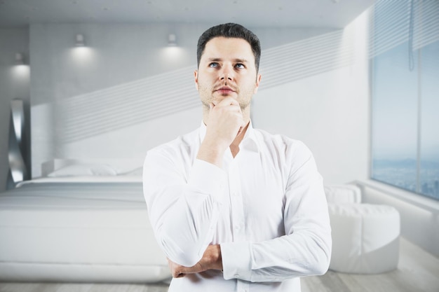 Thoughtful businessman in bedroom