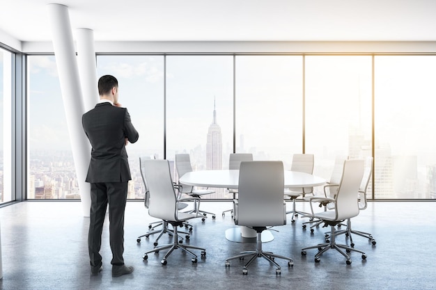 Thoughtful businessman in meeting room