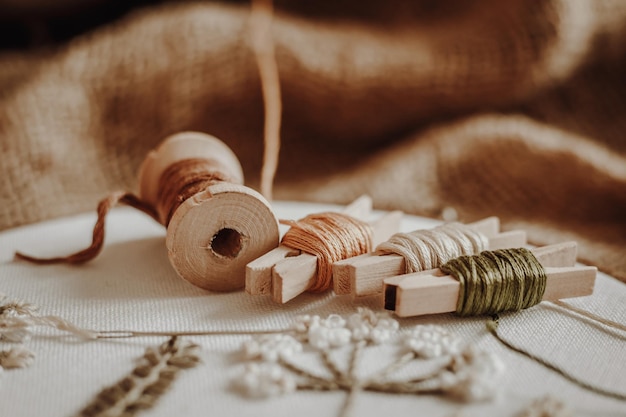 Threads wooden hoop on the background of old fabric burlap