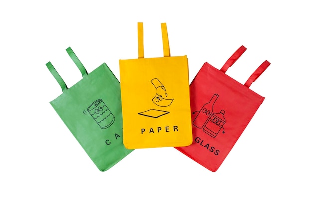 Three bags for separate garbage collection Red yellow and green waste basket on a white background