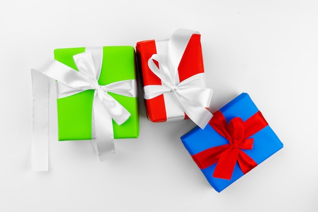 Three beautiful wrapped gifts isolated