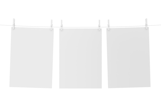 Three blank white papers hanging on a clothesline