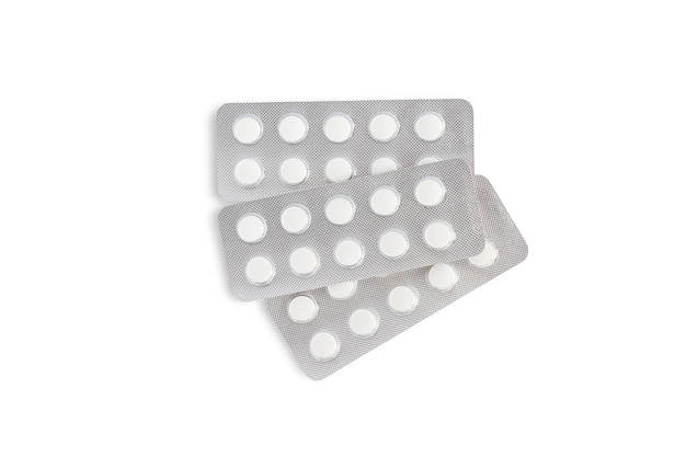 Three blisters of white tablets on a white background