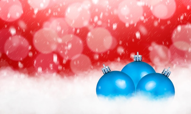 Three blue Christmas decorations on a red background with snow