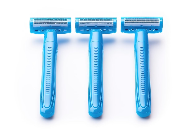 Photo three bright blue razors lined up against a white background showcasing modern shaving tools for daily grooming needs on white or png transparent background