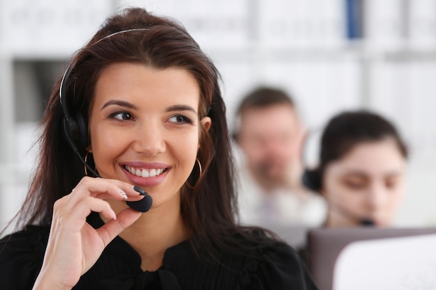 Three call centre service operators at work