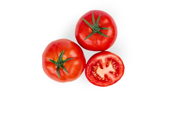 Three cherry tomatoes. Isolated on white background. Top view. High quality photo