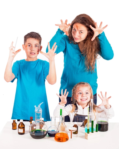 Three children doing experiments with chemical liquids at the lesson The concept of education interest in learning commanded lesson mad scientist