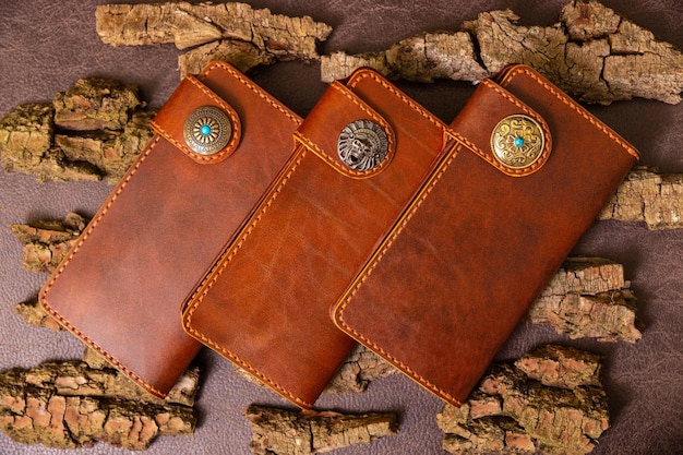 Three closed brown female wallet for cash and credit cards