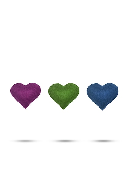 Three colored fabric heart floating on a white background with copy space