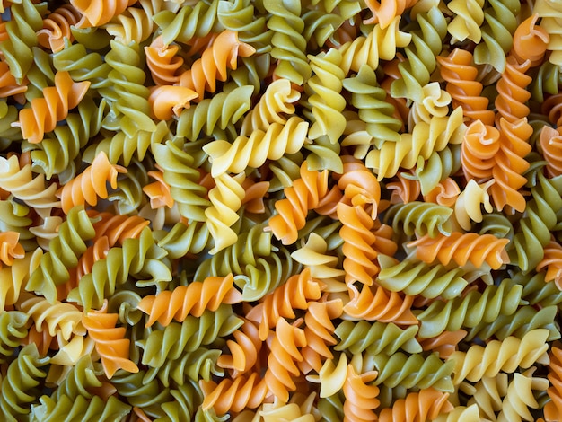 Three Colors Rotini Pasta. Pasta fusilli tricolore background