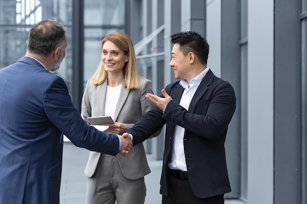 Three experienced managers team leaders meet and get to know from outside the office team diverse