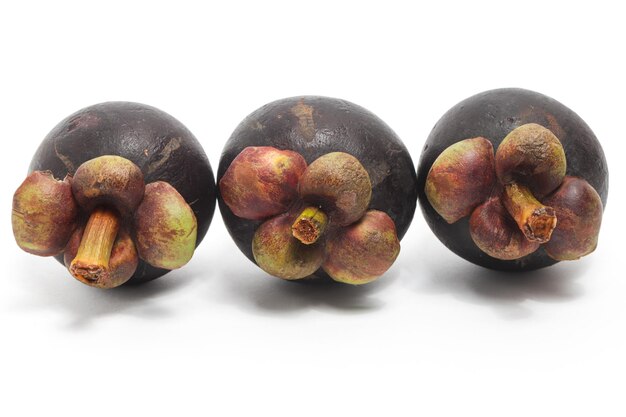 Three fresh organic mangosteen delicious fruit isolated on white background clipping path