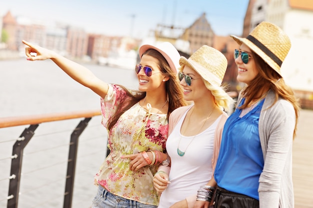 three friends hanging out in the city of Gdansk in Poland