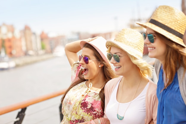 three friends hanging out in the city of Gdansk in Poland