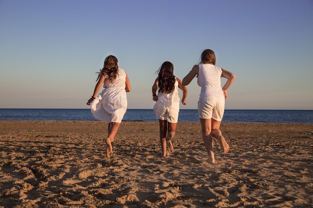 Three girls running