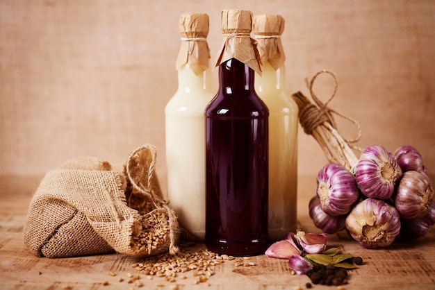 Three glass bottles of homemade sourdough for Easter soup