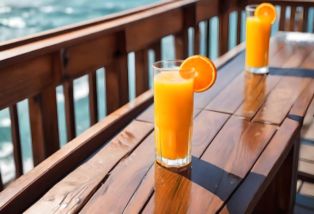 three glasses of orange juice sit on a wooden table