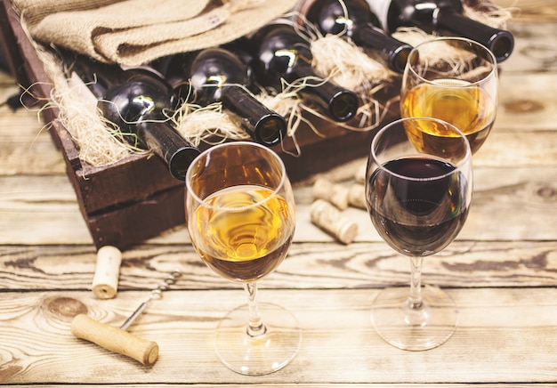 Three glasses of wine on a wooden table. Wine of a new harvest 