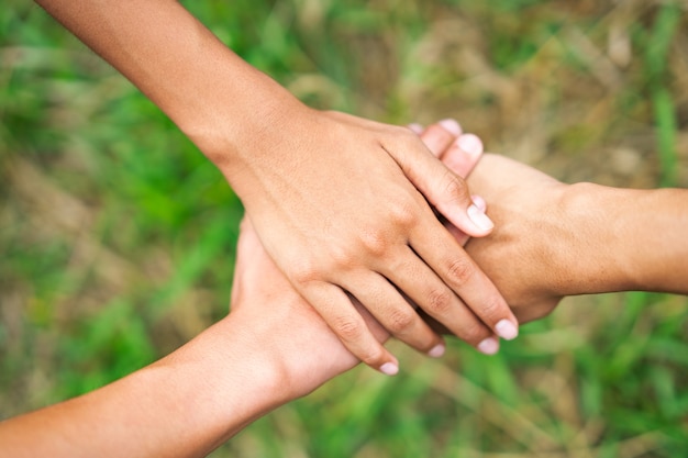 Three hand holding hand connect relationship