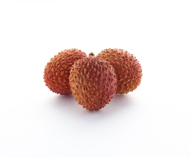 Three lychees with white surface