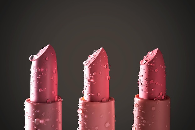 Photo three moisturizing lipsticks with water drops on a dark background