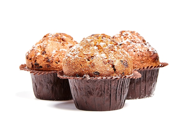 Three muffins with chips of chocolate isolated