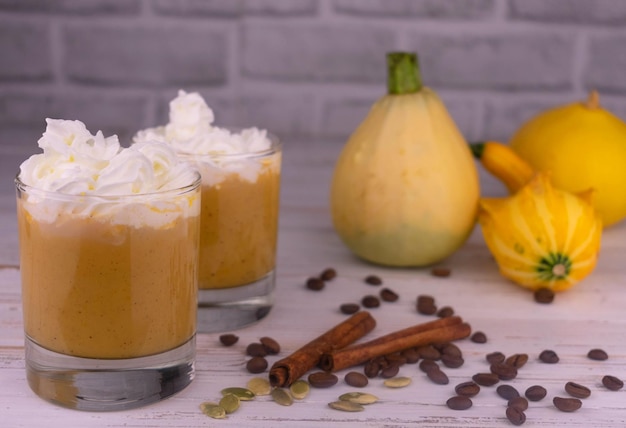 Three orange musk pumpkins on a white background.