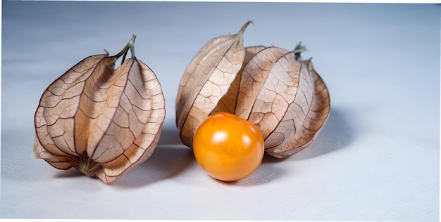 three oranges are next to one another with one that has a leaf on it