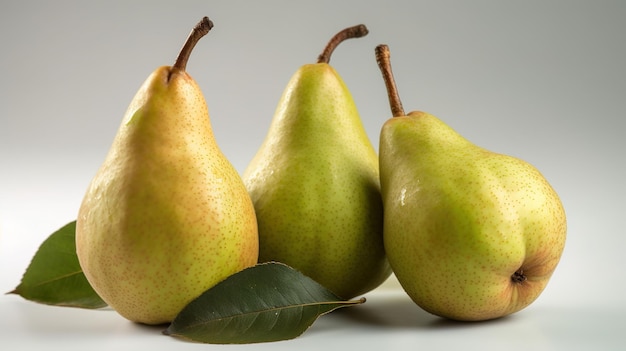 Three pears on a white background with a green leaf.