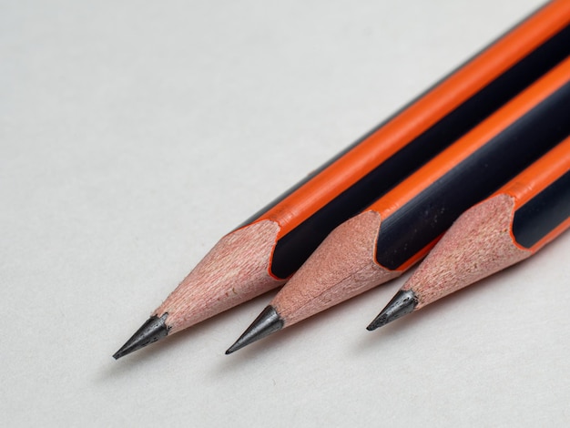 three pencils close-up on a white background