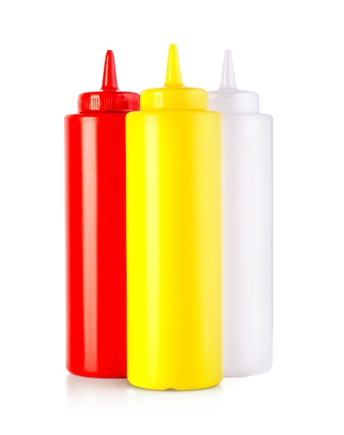 Three plastic sauce bottles  isolated on a white background