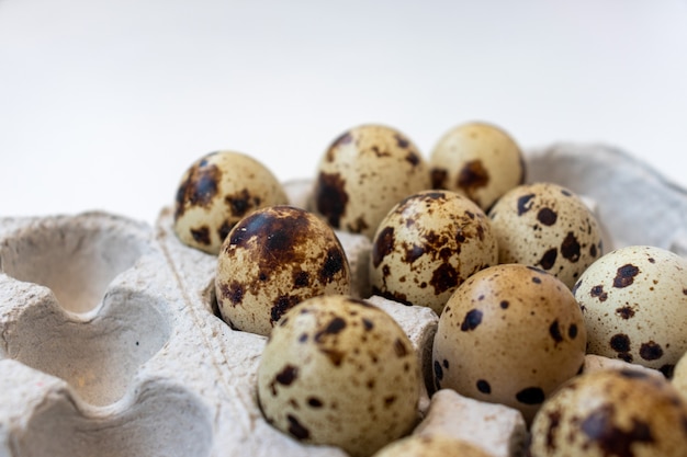 Three Quail eggs easter. Top view. Three fresh quail eggs on a black background.?????. ??????????? ????. Easter composition. Easter background