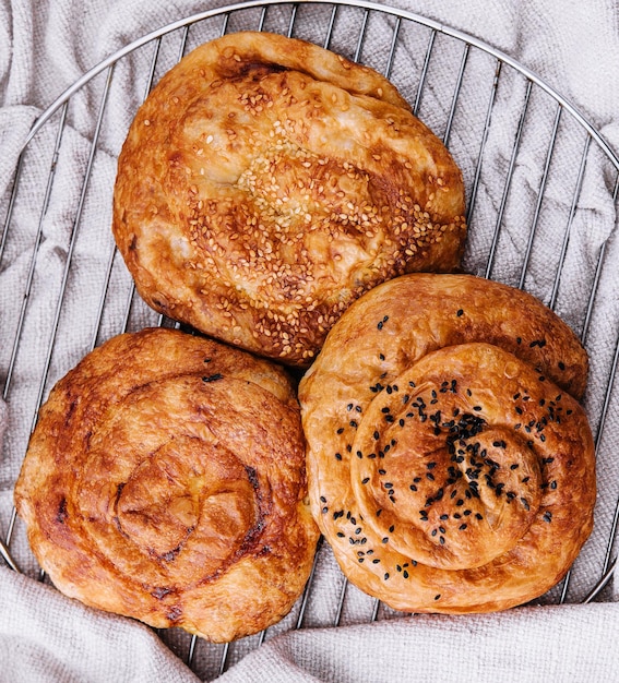 Three raisins buns on a cloth background