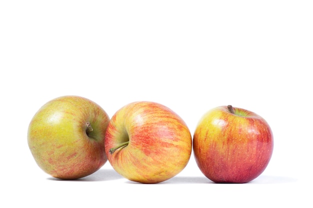 Three ripe sweet apples isolated on a white background