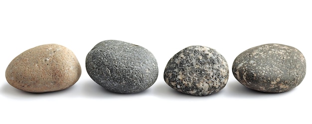 three rocks with one that has a black one on it