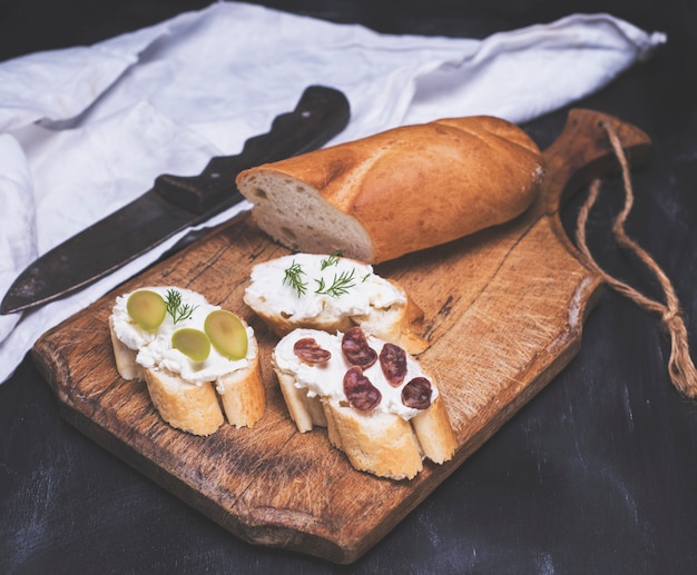 Three sandwiches with cream cheese 