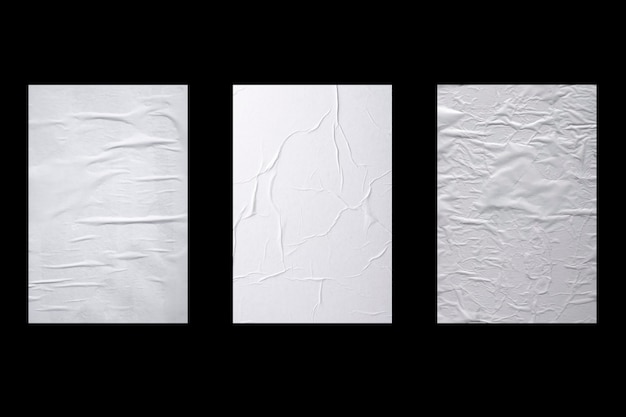 Three sheets of crumpled white paper isolated on black background.