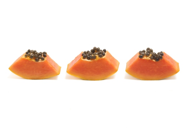 Three sliced fresh organic papaya delicious fruit isolated on white background clipping path