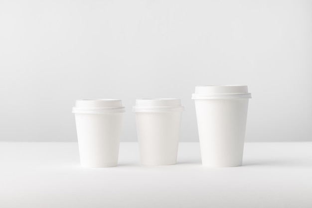 Three white paper Coffee Cups